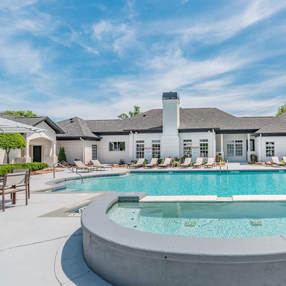 A large house with a pool in the backyard.