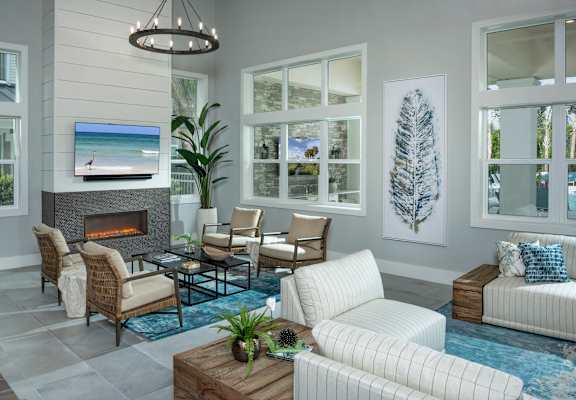 A living room with a fireplace and a television.