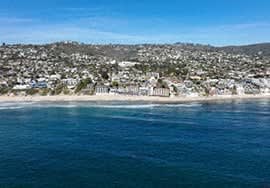 a view of the beach and the city from the ocean