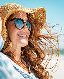 Woman holding hat at beach Captiva Club Miami Florida Apartments at Captiva Club, Miami, 33157