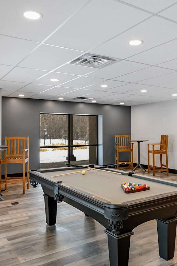 the preserve at ballantyne commons activity room with billiards table and chairs