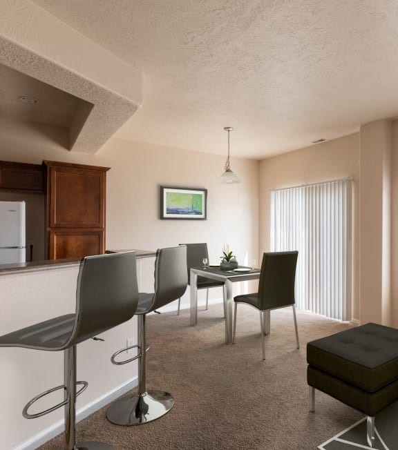 a living room and dining room with a couch and a table