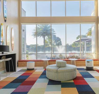 a room with a view of a water fountain and a large window at Lakeside Villas, Orlando Florida