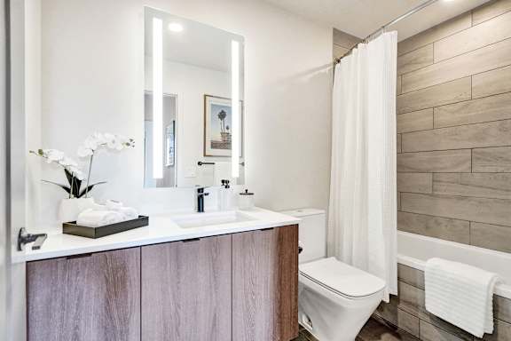 A bathroom with a white toilet and a white sink.