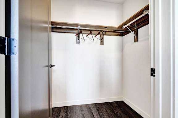 A white door with a silver handle and a silver lock.