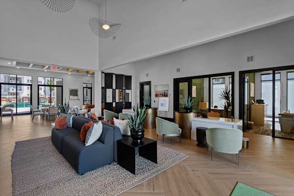 A modern living room with a grey sofa and a coffee table.