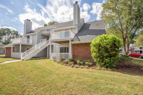 Exterior of property with balconies and staircase from upper level at St. Croix Apartments in Virginia Beach VA