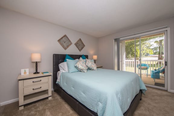 Master Bedroom with exterior doorway to outdoor space at St. Croix Apartments in Virginia Beach VA
