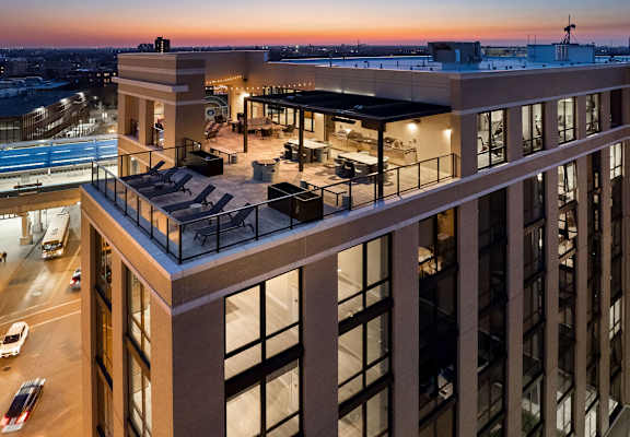 an aerial view of a large building at dusk