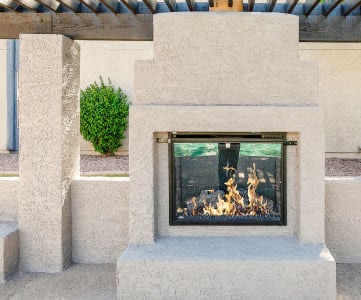 outdoor fireplace lounge at Aztec Springs Apartments in Mesa, AZ 85207