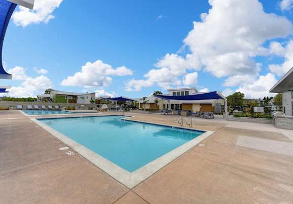 Pool with Lounge Chairs, Blue Skies with Clouds,