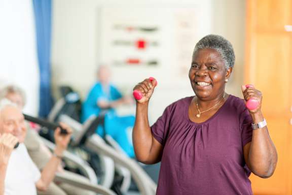 Older woman is exercising at Sweetwater Terraces Apartments, Duluth, GA