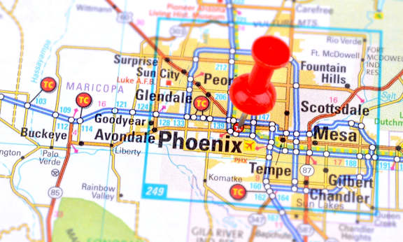 a city pinned on a map of aires