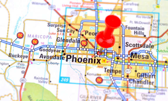a city pinned on a map of aires