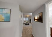 Thumbnail 8 of 13 - an open living room and hallway with a view of a dining room and living room