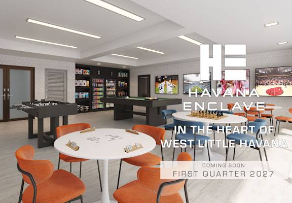 A modern interior space with a white table and orange chairs, and a sign that reads "Havana Enclave in the heart of West Little Havana, coming soon, first quarter 2027.".