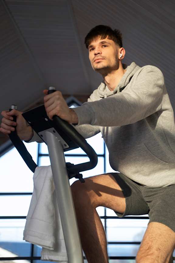 A man is exercising on a stationary bike at Beton Apartments, Wembley, HA9 0SL