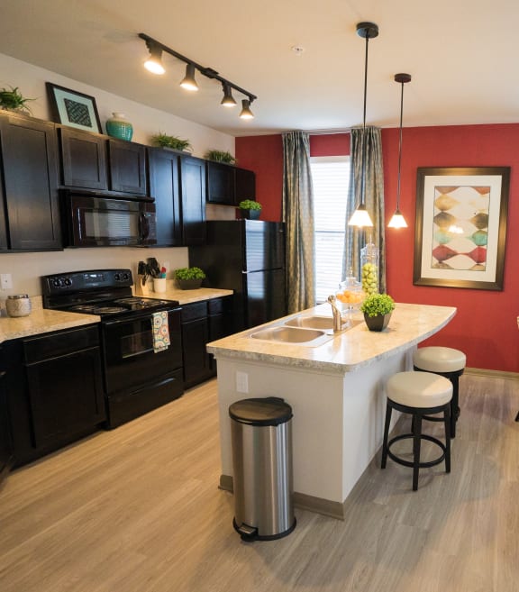 a kitchen and dining room with a table and chairs