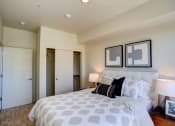 Thumbnail 18 of 31 - Bedroom with cozy bed at Commons at Sylvan Canyon Apartments, Portland, Oregon