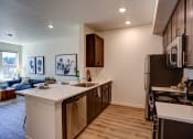 Thumbnail 14 of 31 - Kitchen with wooden cabinets at Commons at Sylvan Canyon Apartments, Portland
