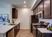Thumbnail 15 of 31 - Wooden cabinets at Commons at Sylvan Canyon Apartments, Portland, OR