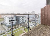 Thumbnail 4 of 4 - a view of a city from a balcony with a balcony railing