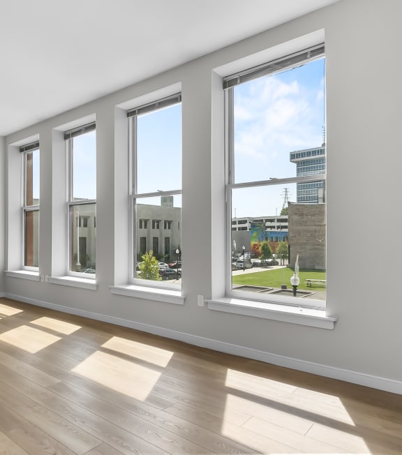 a living room with large windows at 1188 Lofts in Bridgeport, CT, 06604