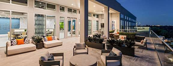 a living room with couches and chairs and a patio