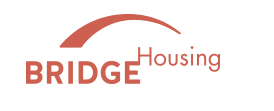 A logo with the word BRIDGE in red and a red swoosh above the word Housing.