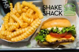 a hamburger and french fries on a tray