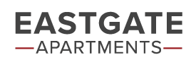 a sign that says eastgate apartments on a black background