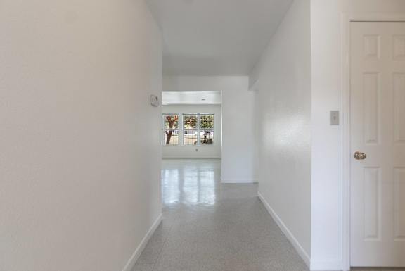 a view of a living room and a kitchen from the hallway of a house at Huntington Village **, Warner Robins, 31098