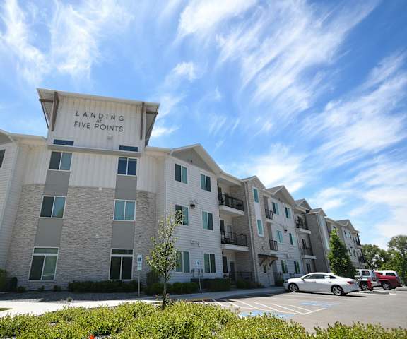 an apartment building with a large sign that reads laughing fire points