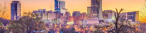 the city skyline at sunset in the winter at Parkside at Five Points Apartments, Raleigh , NC 27608