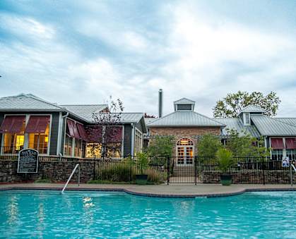 a large swimming pool in front of a house at Riverset Apartments, Memphis, 38103
