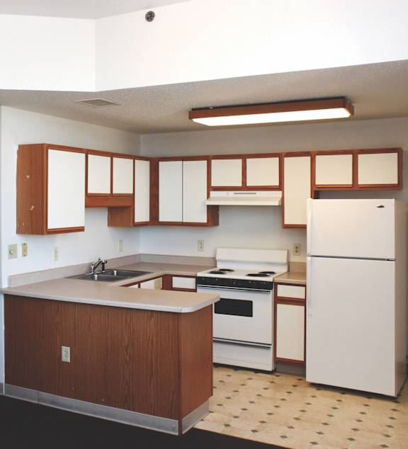 a bedroom with a large bed and a ceiling fan