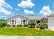 Thumbnail 2 of 8 - a white and brick house with a lawn in front of it at Huntington Village **, Warner Robins, 31098