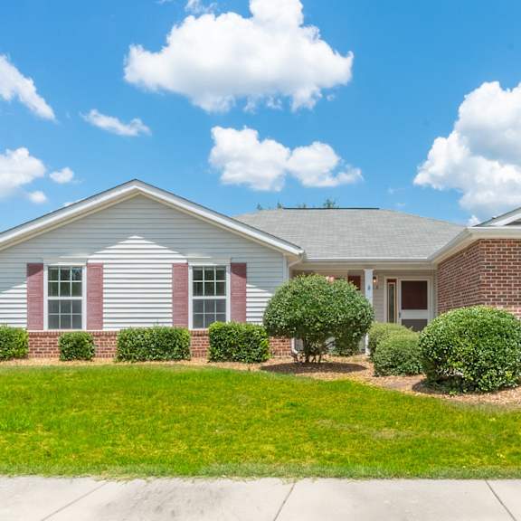a white and brick house with a lawn in front of it at Huntington Village **, Warner Robins, 31098