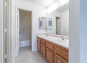 Thumbnail 6 of 8 - a bathroom with two sinks and a large mirror at Huntington Village **, Georgia