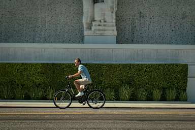 A man riding a bike on a road.