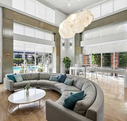 a living room with a large couch and a coffee table