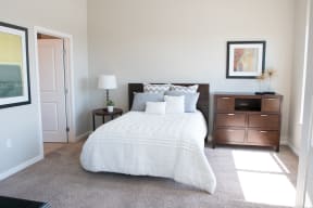 Sacramento Luxury Apartments-The Penthouses at Capitol Park-Bedroom with Carpet Flooring, Window Coverings and Direct Sunlight
