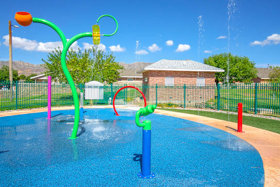 a water park with water toys in a pool