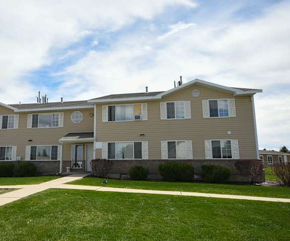 a large house with a sidewalk in front of it