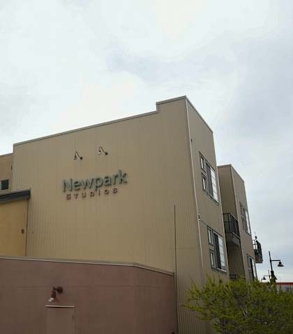 a view of the side of a building with a sign on it