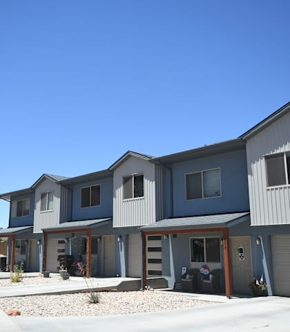 a row of houses on the side of a street