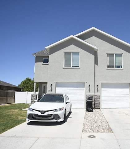 a car parked in front of a house