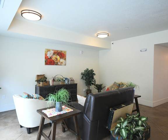 a living room with a couch and a chair and a table