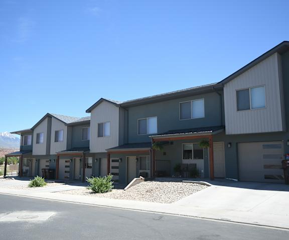 a row of houses with mountains in the background