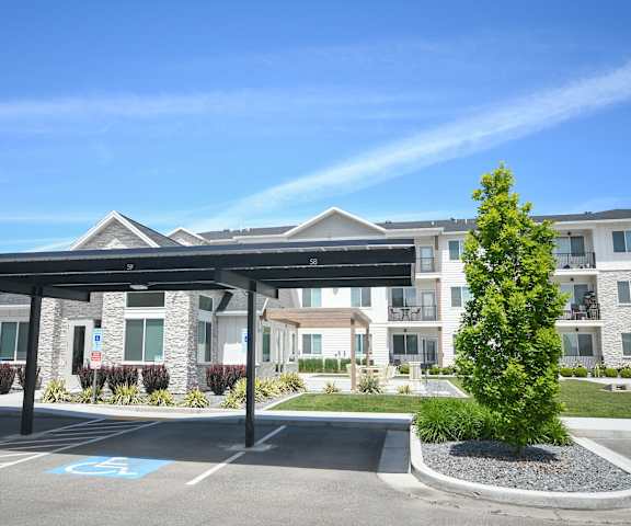a parking lot in front of an apartment building